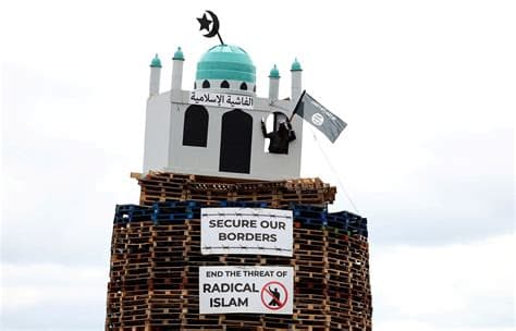 Politicians condemn replica of mosque set alight in anti-migrant bonfire in Northern Ireland