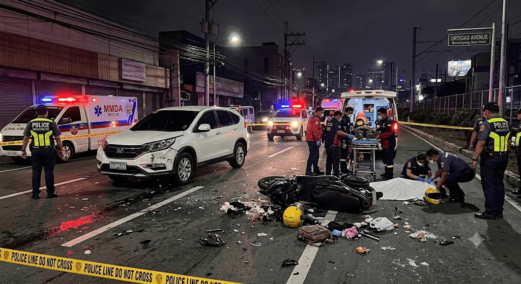 Tragedy on Ortigas Avenue: Woman Killed, TNVS Rider Critically Injured after SUV Plows into Motorcycle