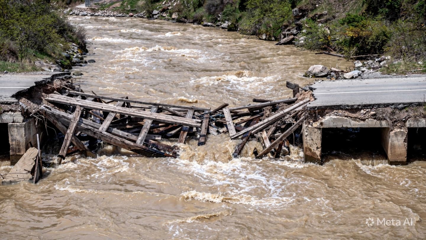  Beneath the Torrential Cascade of Rain, Crucial Bridges Wash Into the River