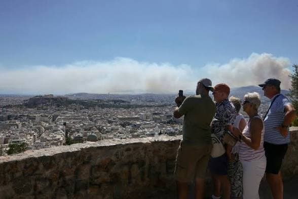 Greece fights fires near Athens as France and Spain improve