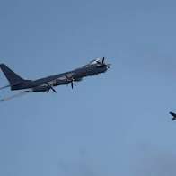 UK says aircraft carrier approached by Russian plane in Norwegian Sea before being escorted away by UK fighter jets