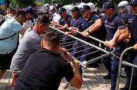 Albanian police use tear gas and water cannons to disperse anti-government protests in Tirana