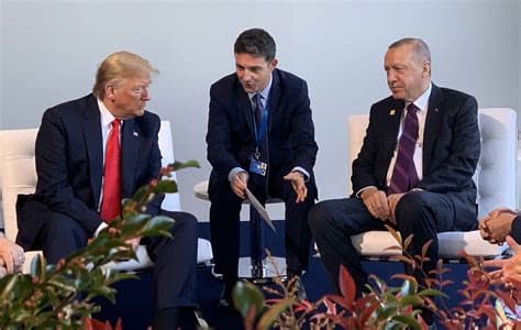 Erdogan gifts Trump gold-plated revolver during NATO summit