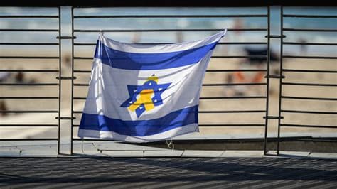 Polish MP Ignites Controversy by Displaying Israeli Flag Defaced with Swastika Polish MP Ignites Controversy by Displaying Israeli Flag Defaced with Swastika