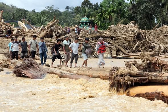 Flash Floods Sweep Logs Ashore in Batang Toru, North Sumatra Flash Floods Sweep Logs Ashore in Batang Toru, North Sumatra